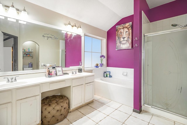 full bathroom with a shower stall, lofted ceiling, double vanity, a bath, and a sink