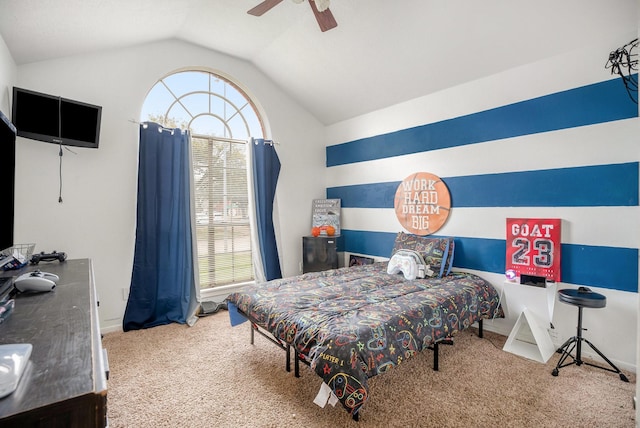 bedroom with ceiling fan, carpet flooring, and vaulted ceiling