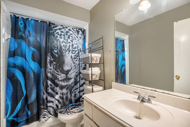 bathroom featuring vanity, curtained shower, and toilet