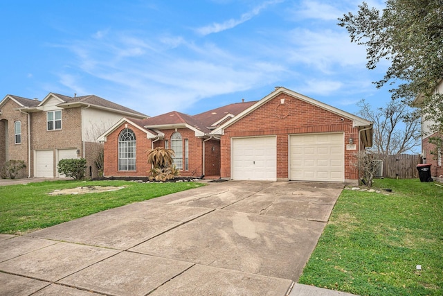 ranch-style home featuring a front yard, fence, driveway, a garage, and brick siding