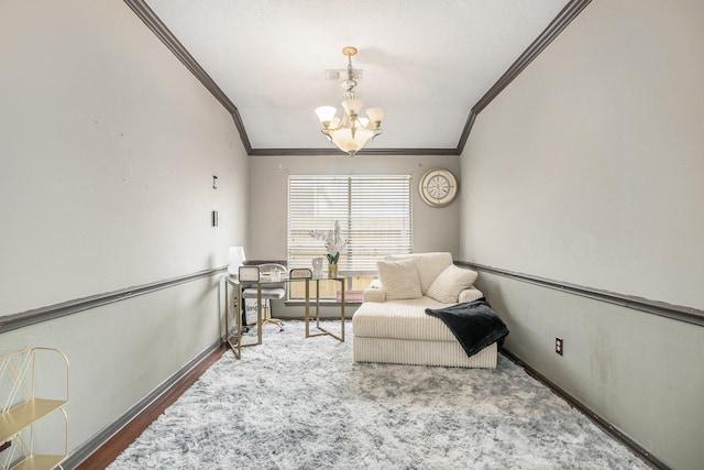 living area with a notable chandelier, crown molding, and baseboards