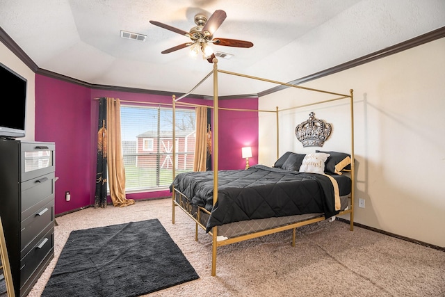 bedroom with visible vents, a textured ceiling, carpet flooring, and crown molding