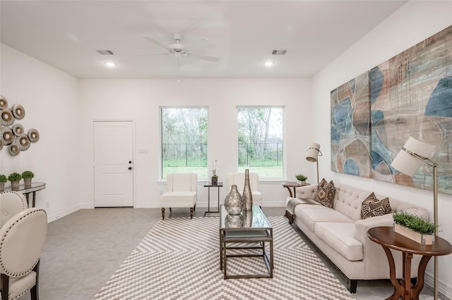 living area with visible vents, recessed lighting, baseboards, and ceiling fan