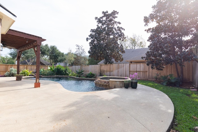 view of swimming pool with a patio area, a pool with connected hot tub, and a fenced backyard