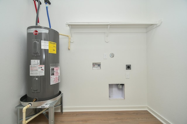 laundry area featuring washer hookup, water heater, laundry area, wood finished floors, and hookup for an electric dryer