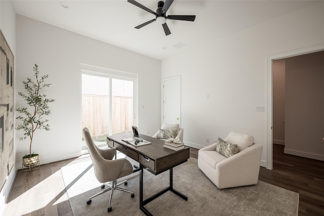 home office featuring baseboards, ceiling fan, and wood finished floors