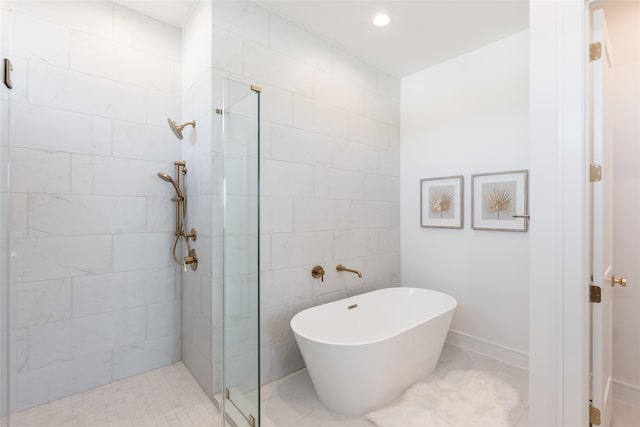 bathroom featuring a soaking tub, recessed lighting, a stall shower, and tile walls