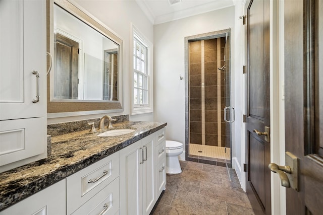 bathroom featuring visible vents, toilet, ornamental molding, a stall shower, and vanity