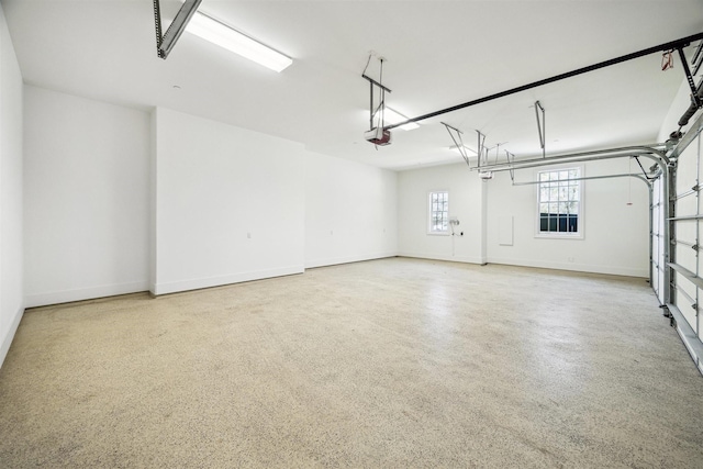 garage featuring baseboards and a garage door opener