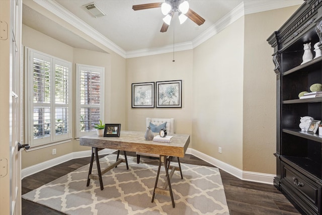 home office featuring visible vents, dark wood-type flooring, a ceiling fan, crown molding, and baseboards