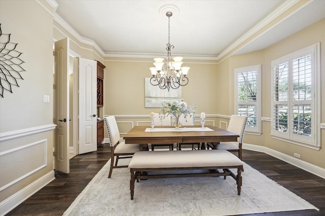 dining area with a chandelier, dark wood-style floors, a decorative wall, and ornamental molding