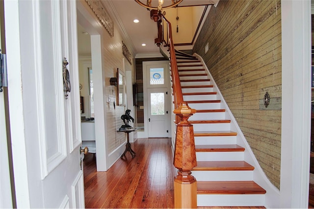317 S Penn St, Flatonia, TX 78941 - entryway featuring stairs, crown molding, recessed lighting, wood walls, and wood-type flooring