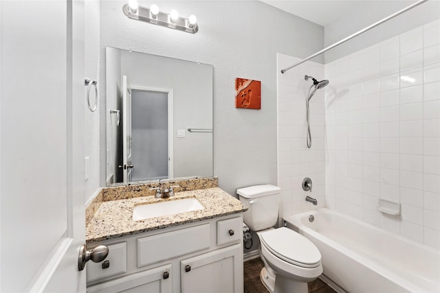 full bathroom featuring vanity, shower / tub combination, and toilet