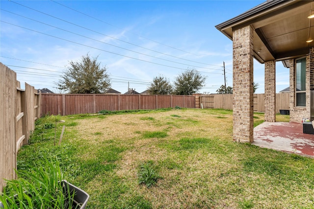 view of yard featuring a fenced backyard and a patio