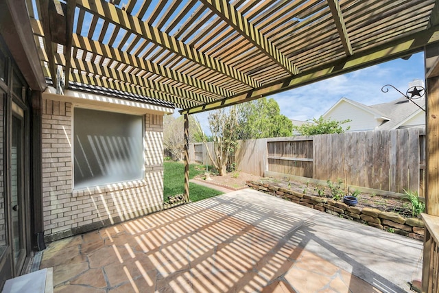 view of patio / terrace with a fenced backyard and a pergola