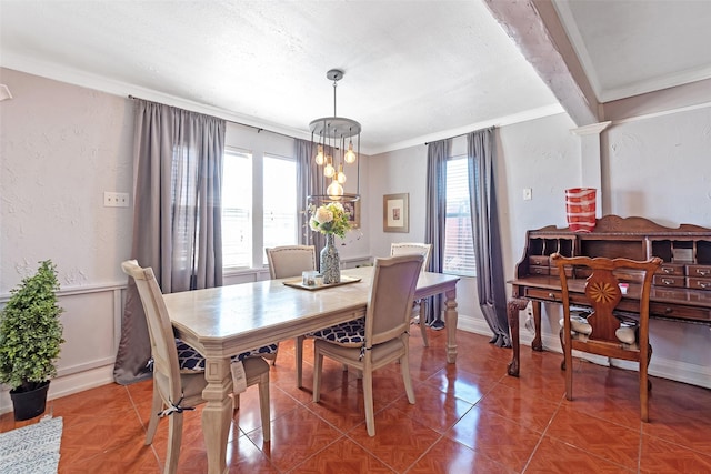 dining room with crown molding, a textured wall, baseboards, and a textured ceiling