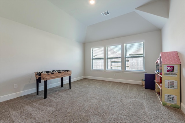 rec room with visible vents, carpet floors, baseboards, and vaulted ceiling