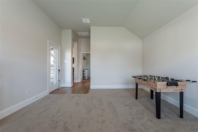 playroom with visible vents, baseboards, lofted ceiling, and carpet floors