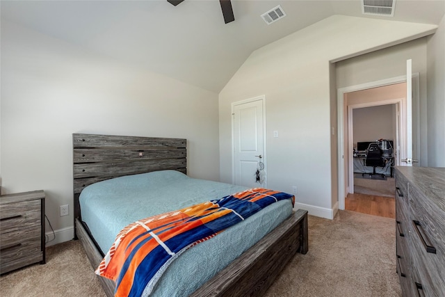 bedroom featuring lofted ceiling, a ceiling fan, visible vents, and carpet floors