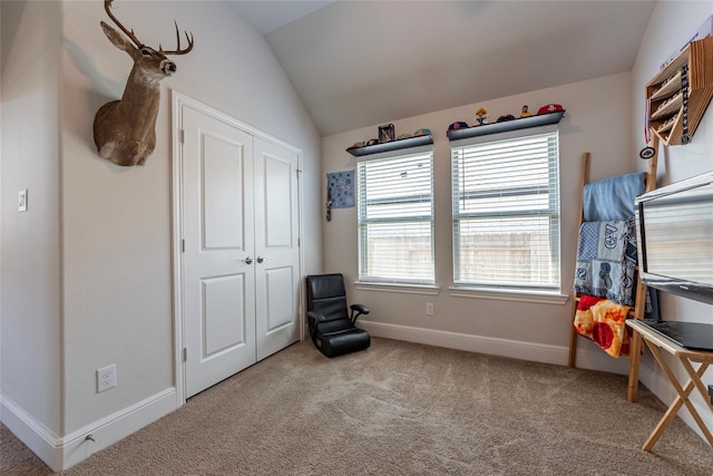 living area featuring carpet flooring, baseboards, and vaulted ceiling