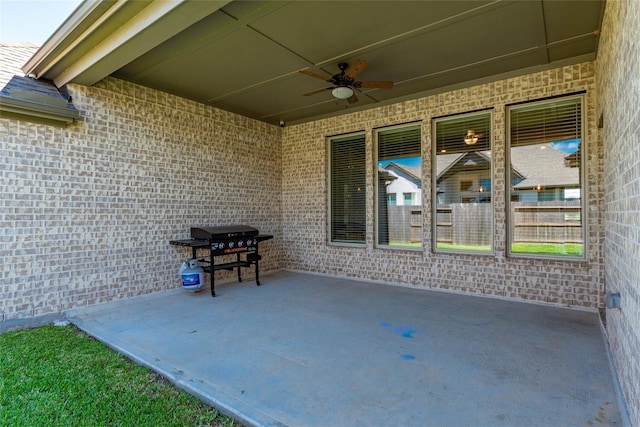 view of patio / terrace with area for grilling and a ceiling fan