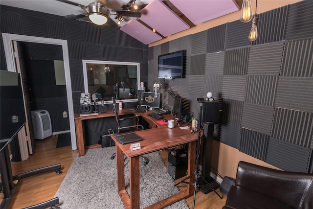 office space with ceiling fan, wood finished floors, and vaulted ceiling