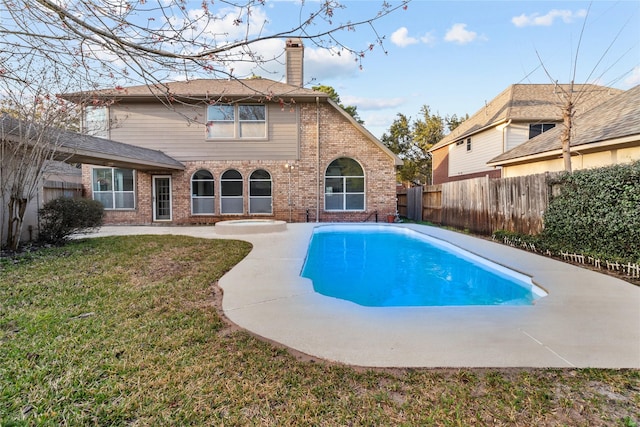 view of swimming pool featuring a fenced in pool, a yard, and fence