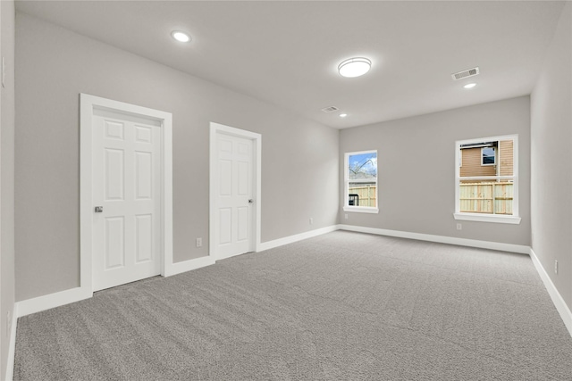 interior space featuring visible vents, recessed lighting, baseboards, and carpet floors