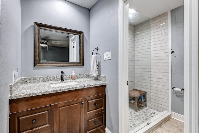 bathroom featuring vanity, a stall shower, and tile patterned flooring