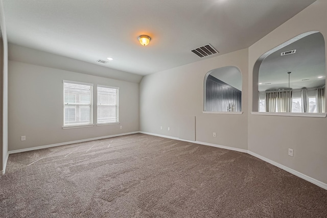 unfurnished room with visible vents, carpet flooring, and baseboards