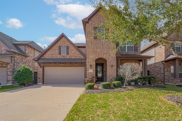 traditional-style house with brick siding, concrete driveway, and a front lawn