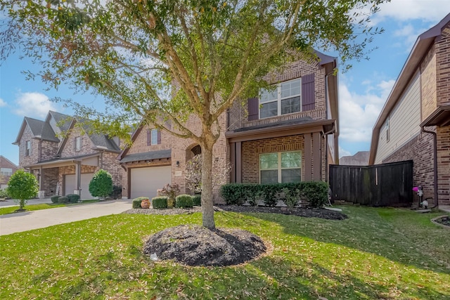 traditional-style home with brick siding, a garage, driveway, and a front lawn