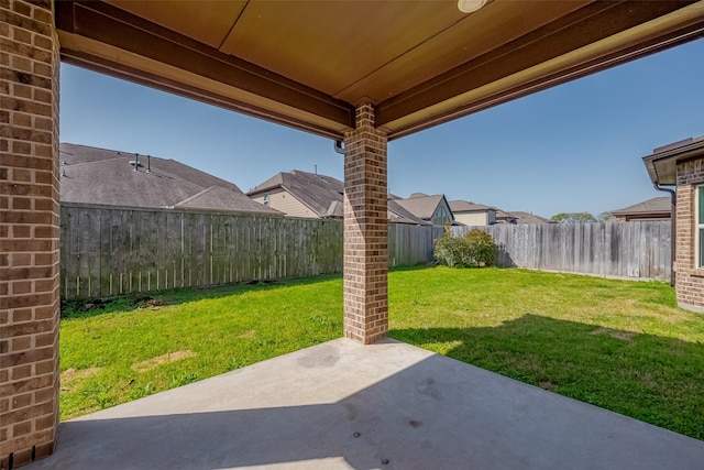 view of yard featuring a patio area and a fenced backyard