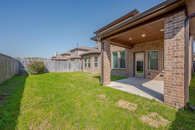 view of yard with a fenced backyard and a patio area