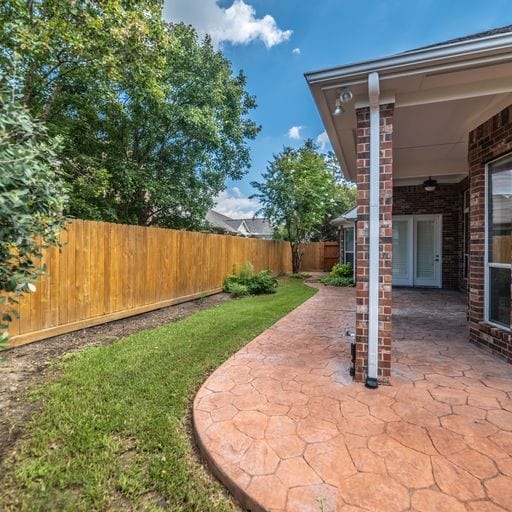 view of yard featuring a patio and a fenced backyard