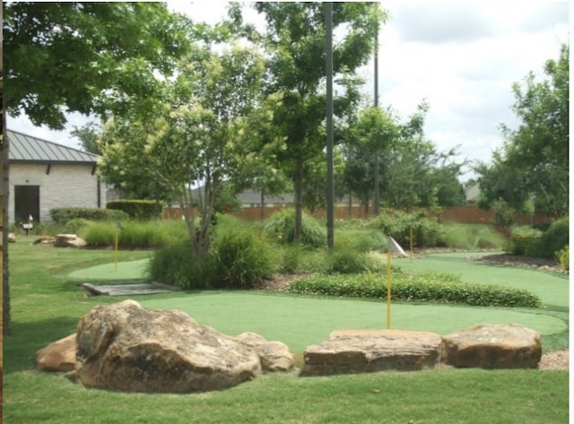 view of home's community with a lawn