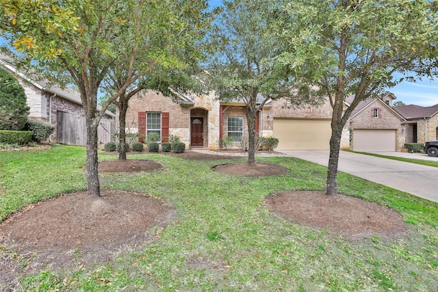 ranch-style home featuring driveway, stone siding, a front yard, an attached garage, and brick siding