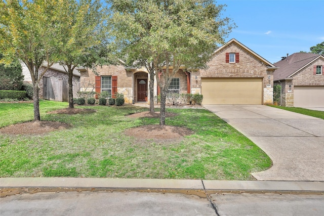 view of front of home featuring stone siding, a front lawn, concrete driveway, and a garage