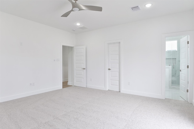 unfurnished bedroom with recessed lighting, carpet, visible vents, and baseboards