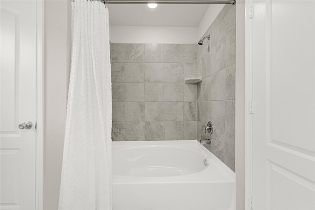 bathroom featuring shower / bathtub combination with curtain