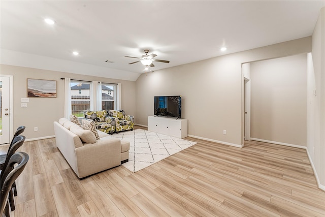 living room featuring recessed lighting, a ceiling fan, baseboards, and light wood finished floors