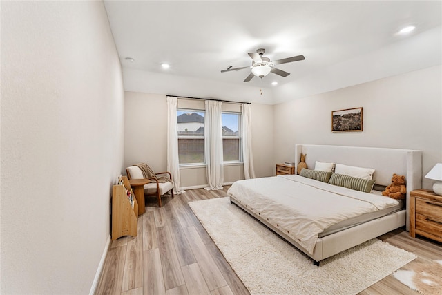 bedroom featuring recessed lighting, light wood-type flooring, baseboards, and a ceiling fan