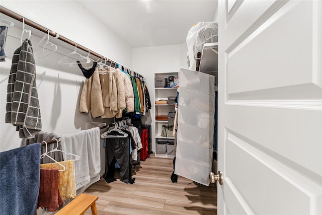 spacious closet with wood finished floors