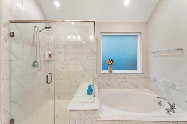 bathroom featuring recessed lighting, a garden tub, and a stall shower