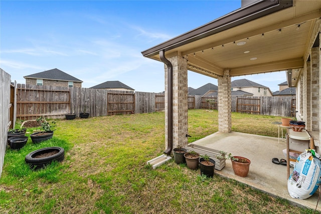 view of yard featuring a patio and a fenced backyard