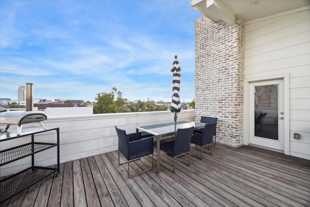 wooden deck with outdoor dining space