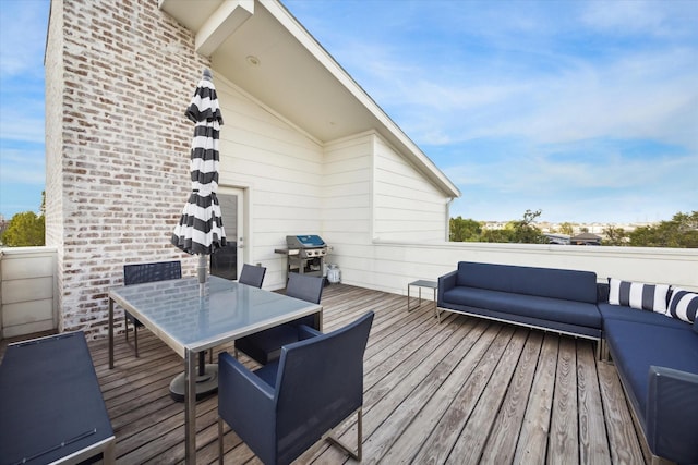 wooden deck with outdoor dining space, an outdoor living space, and a grill