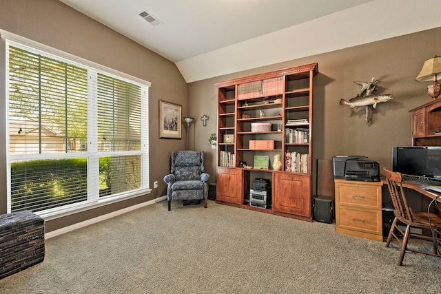 home office with visible vents, carpet flooring, baseboards, and vaulted ceiling