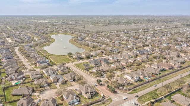 bird's eye view featuring a residential view and a water view