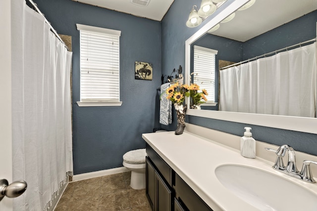 full bathroom featuring tile patterned floors, visible vents, toilet, baseboards, and vanity